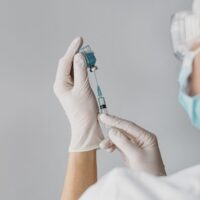 doctor-holding-syringe-for-vaccine (1)